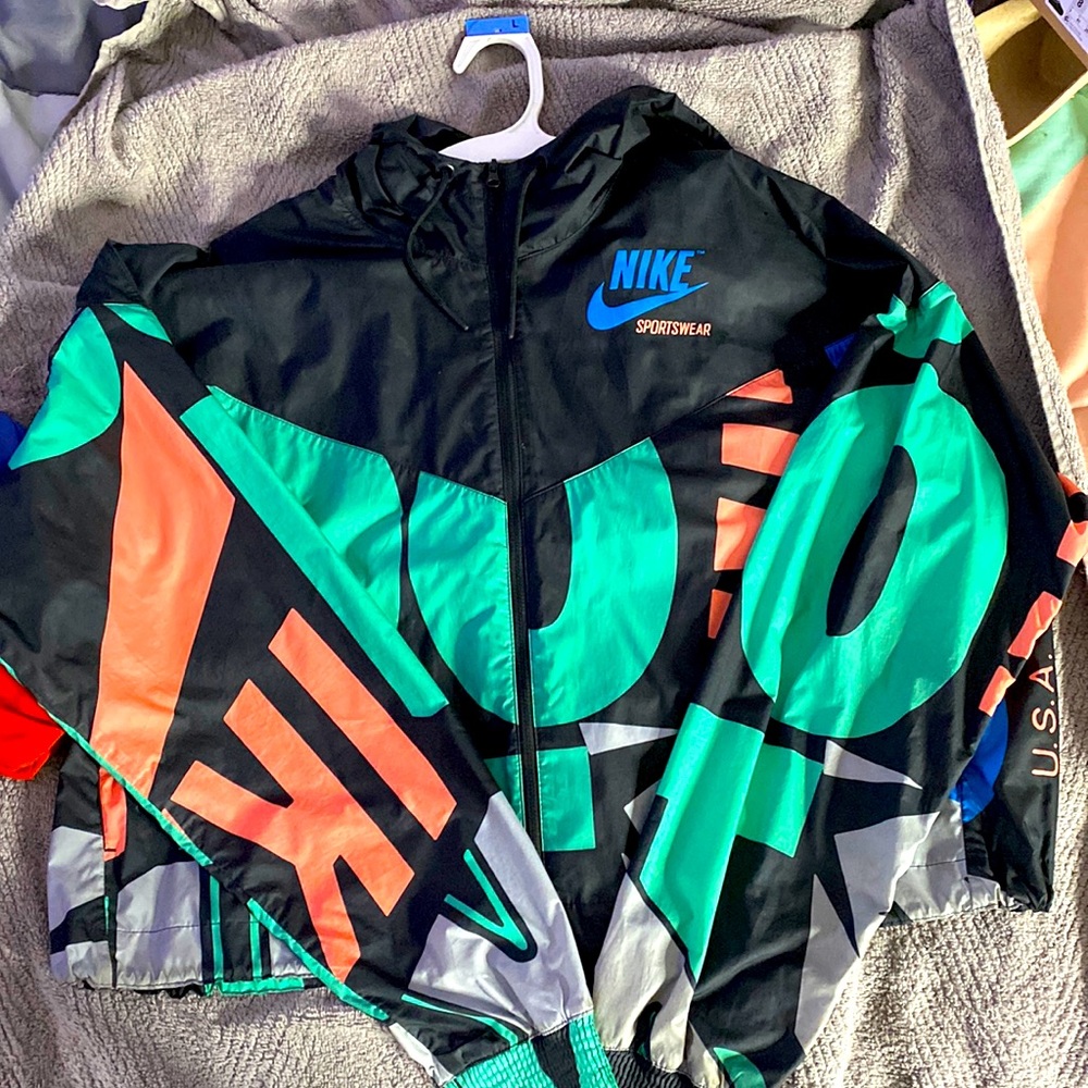 This is a large Nike crop wind breaker